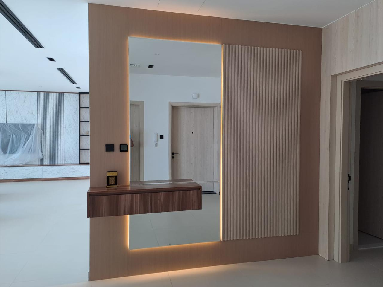 Wall cladding and vanity counter installation — UAE interior joinery