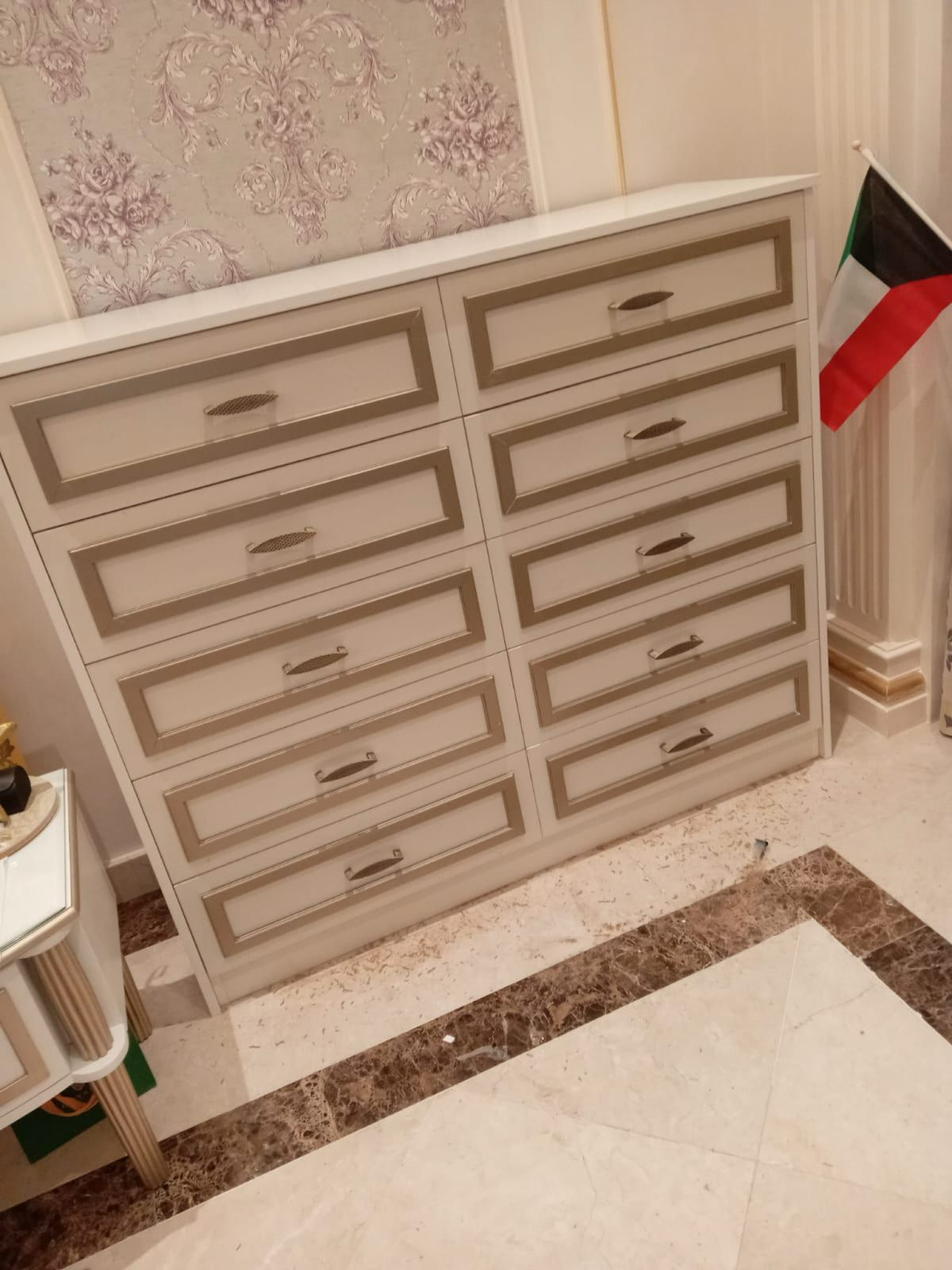 White chest of drawers with gold trim — bedroom fit-out